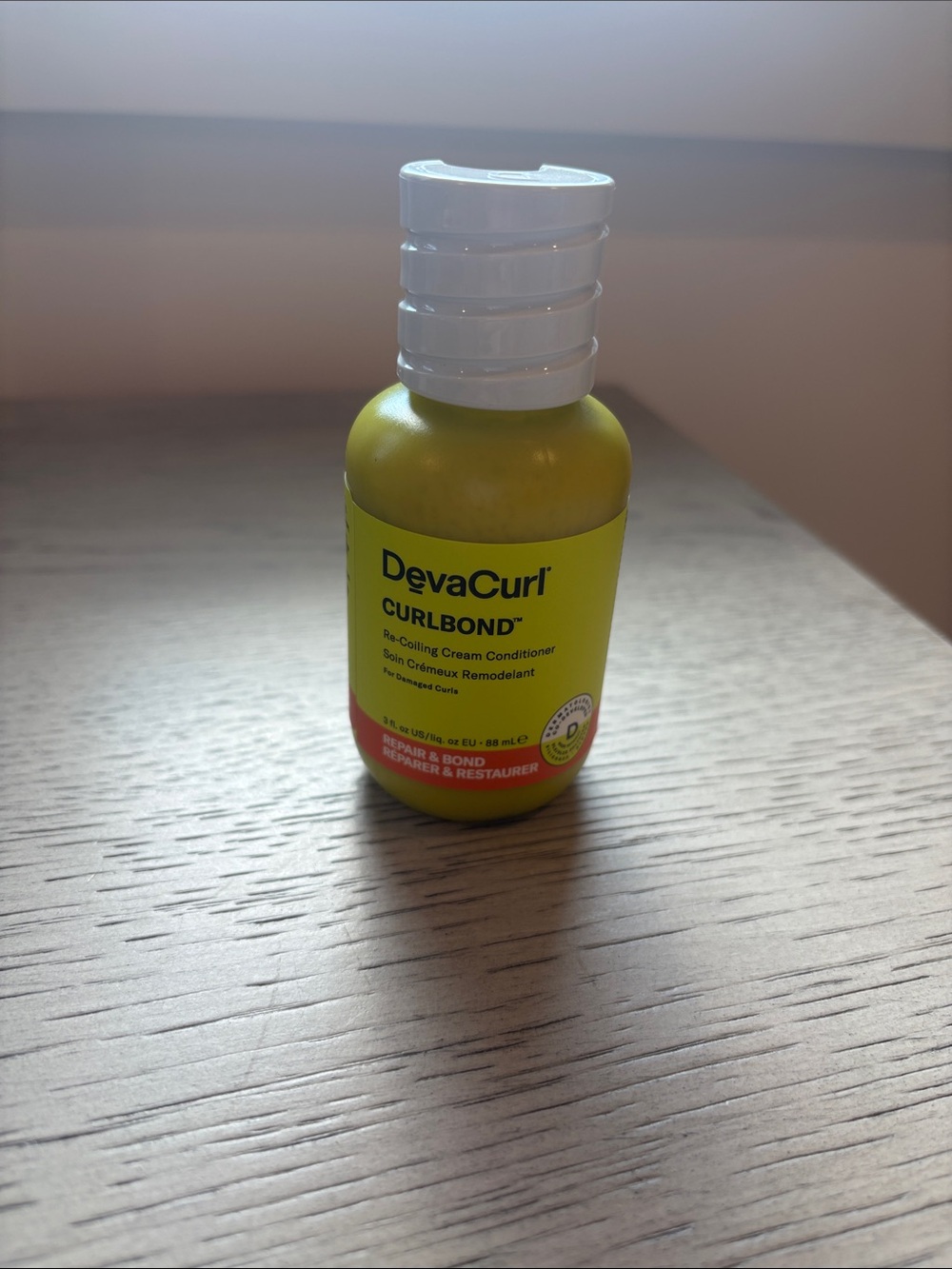 DevaCurl Curbond Re-Coiling Cream Conditioner - Yellow and White Bottle